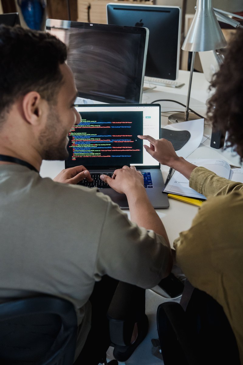Engineers reviewing application code